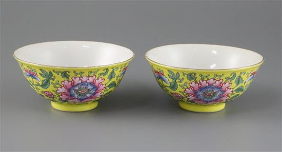 A pair of Chinese yellow ground famille rose bowls, Daoguang six character seal mark and probably of the period (1821-50), Diam.11.5cm